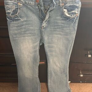Blue Boot Cut Jeans with Faded Wash and Distressing